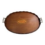 An Edwardian inlaid mahogany oval serving tray with brass handles, 59cm x 38cm.