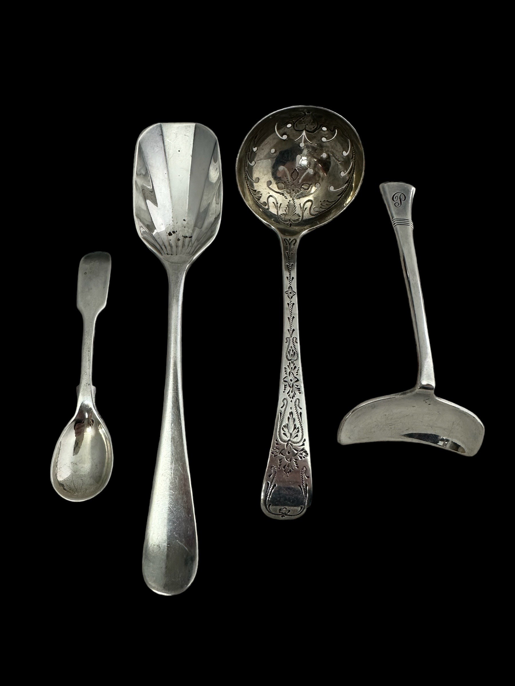 Some sterling silver items including an art deco 1920 spoon by Daniel & Arter, an Edwardian tea