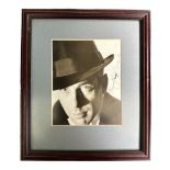 Humphrey Bogart (1899-1957) – A framed black and white photograph signed by Humphrey Bogart in black