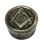 A small silver Masonic pill box with the Masonic emblem on the front. Marked 925 to base.