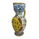 An Italian maiolica (tin glazed) apothecary jug. Decoration surrounds central reserve on which is