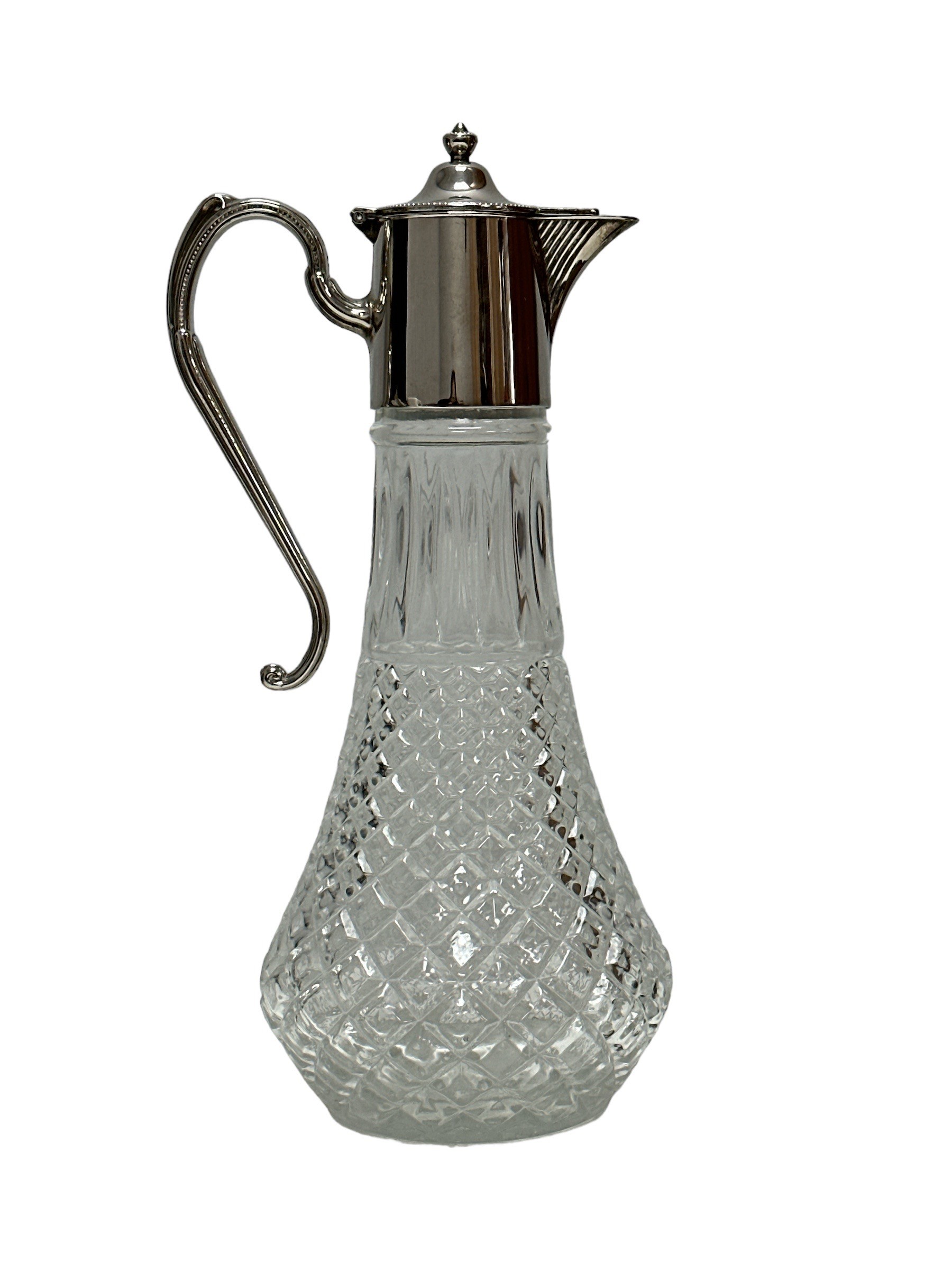 A glass claret jug with silver plated mount decorated with a beaded edge, approx 30cm high. Very