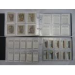 Collection of Wills cigarette card sets in 4 albums, in mixed condition, but generally good, with