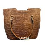 A crocodile skin (possibly faux) handbag with leather interior. Dimensions approx 29cm x 24cm.