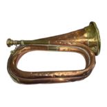 A Copper and Brass military Bugle by Mayers & Harrison, Manchester. Numerous dents.