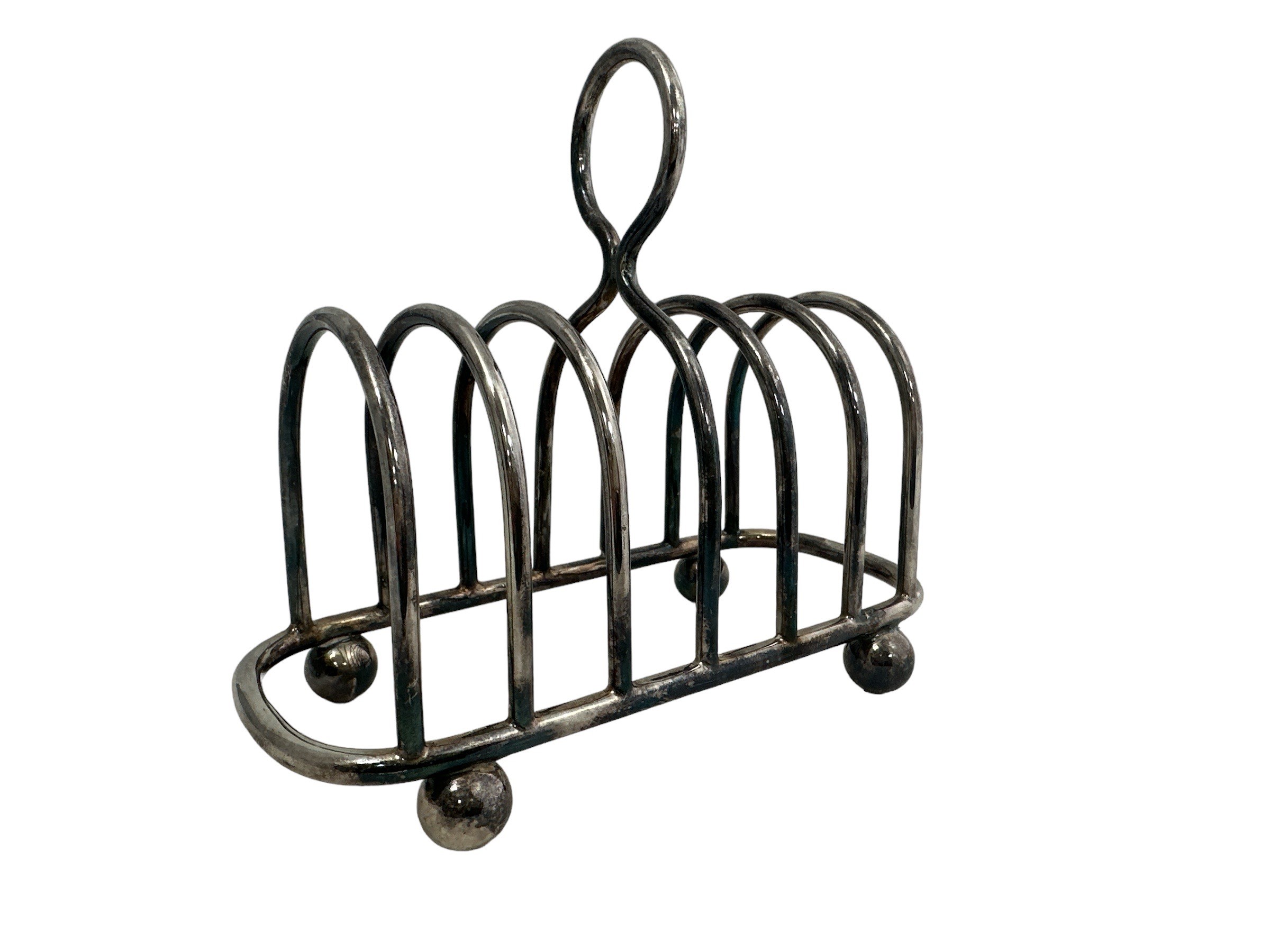 Silver plate 7 bar toast rack by Walker & Hall, central ring handle and bun feet.