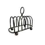 Silver plate 7 bar toast rack by Walker & Hall, central ring handle and bun feet.