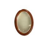 Mahogany framed oval mirror, with inlaid band, 87cm x 63cm, area of damage to edge on one side.