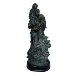 Sculpture of mother, father and child (boy) made to look like patinated bronze, signed ‘’Emicio’.