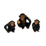 Sylvac, a trio of Sylvac seated monkey figurines, larger monkey holding a piece of fruit (height