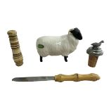 Beswick black faced ram, bone needle case, bottle stopper and small knife.