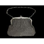 CHARITY - being sold on behalf of Acorn's children's hospice. A silver mesh evening bag with