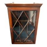 Early 19th Century mahogany glazed wall-hanging cabinet with divided interior fitted with two base