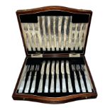 A twenty-four piece Victorian hallmarked silver dessert cutlery set with silver forks and blade on