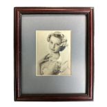 Audrey Hepburn (1929-1963) – A framed black and white photograph signed by Audrey Hepburn “With love