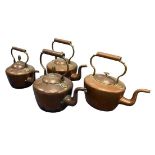 Four vintage copper kettles.