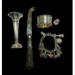 A range of silver items including a napkin holder, thimble, candlestick (weighted) and a boxed