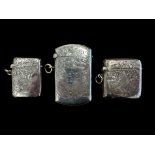 3 Silver Vesta lighters. A George V, 1914, lighter approx 63mm in length, an Edwardian lighter