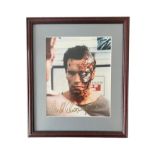 Arnold Schwarzenegger (b.1947) – A framed colour photograph signed by Arnold Schwarzenegger in