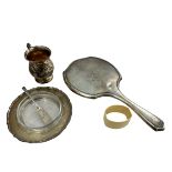 A silver handheld dressing mirror, a silver tankard, a butter dish with separate glass interior