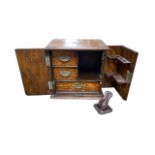 Smokers cabinet with two doors to front, three internal drawers with drop handles, pipe rack, shield