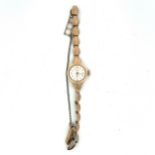 A 9ct gold ladies watch by Regency, 17 jewels. Watch is stamped 375, bracelet has a leaf design