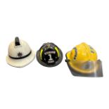 A selection of three Fire Fighting helmets to include; a Cairns & Brother FireFighter Yellow O.W.L