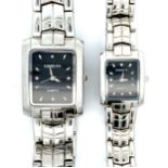 Geneva His & Hers stainless steel watches in case. Quartz movement. Gents style J2491. Ladies