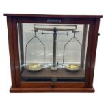 Griffin & Tatlock laboratory scales in wooden and glass case with Griffin & George Limited plaque.