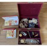 A jewellery box containing silver and costume jewellery including a nephrite pendant.