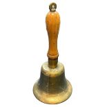 An Air Raid Precautions (ARP) brass hand bell with wooden handle. Marked J.B. and 39.
