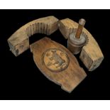 Wooden butter mould decorated with a carved cow, plus a small wooden butter churner. (2)