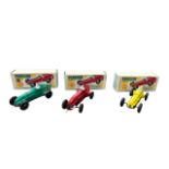 1950s Trio of Penguin Racer, plastic race car with rubber drive, red, yellow and green examples,