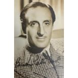 Basil Rathbone (1892-1967) – A framed black and white photograph signed by Basil Rathbone in black