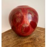A red Lustre ware hand painted vase, with hanging fruit decoration marked directly into the glaze.