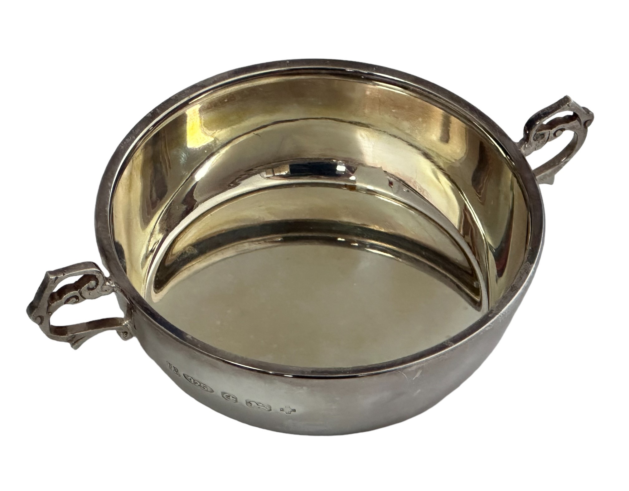 A boxed silver Barker Ellis bowl with twin scroll handles. Diameter 9.5cm, Weight 102g.