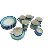 A set of 1930s' Gray's pottery blue and green striped cups and saucers, (6 saucers, 5 cups), milk