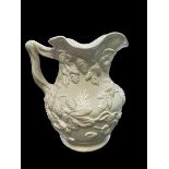 A Minton Stoneware jug, no 324. Height 16cm approx.