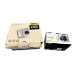 2x Digital Cameras. 1x Nikon Coolpix 2100 with original box, instruction booklet, charger, AV leads,