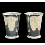 A silver pair of cups by Barker Ellis. 8cm in height. Fully hallmarked. Weight 151g in total.