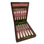 A cased set of 6 fish knives and forks with silver collars and mother of pearl handles. Made by J.