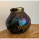 John Ditchfield (British, 1952-) a iridescent purple studio glass vase with swirling pattern