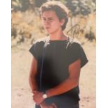 River Phoenix (1970-1993) – A framed colour photograph signed by River Phoenix in black ink “River
