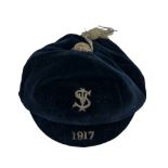 A vintage blue velvet cricket cap, dated 1917. Embroidered with the letters S I and V.
