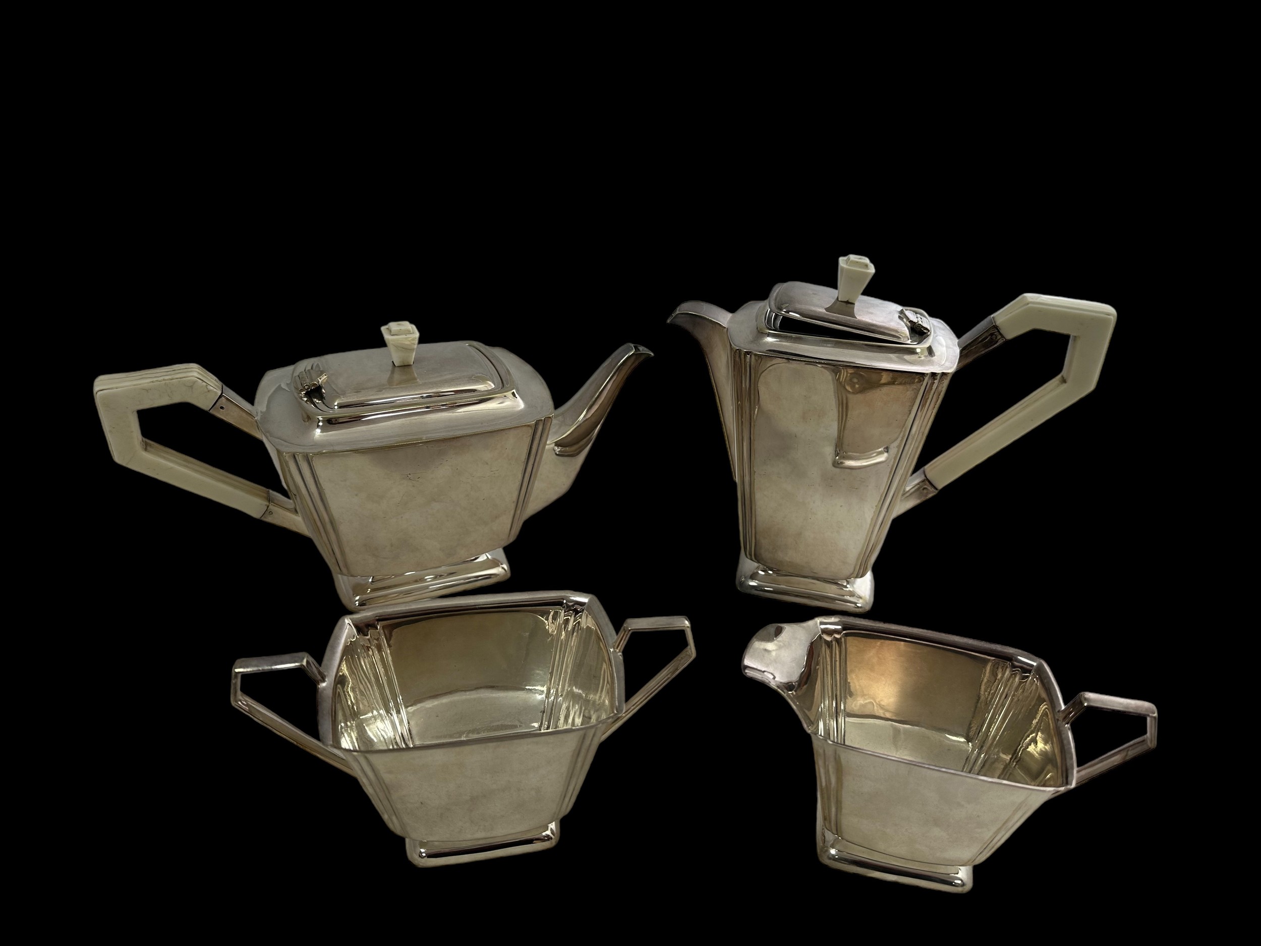 A silver plated Art Deco style four piece tea and coffee service with stylised design. Comprising of