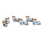 Staffordshire, group of Staffordshire miniature calf figurines, five with similar design and one
