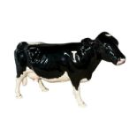 Beswick, a Beswick Shetland Cow, in gloss, model no. 4112. Height 12cm.