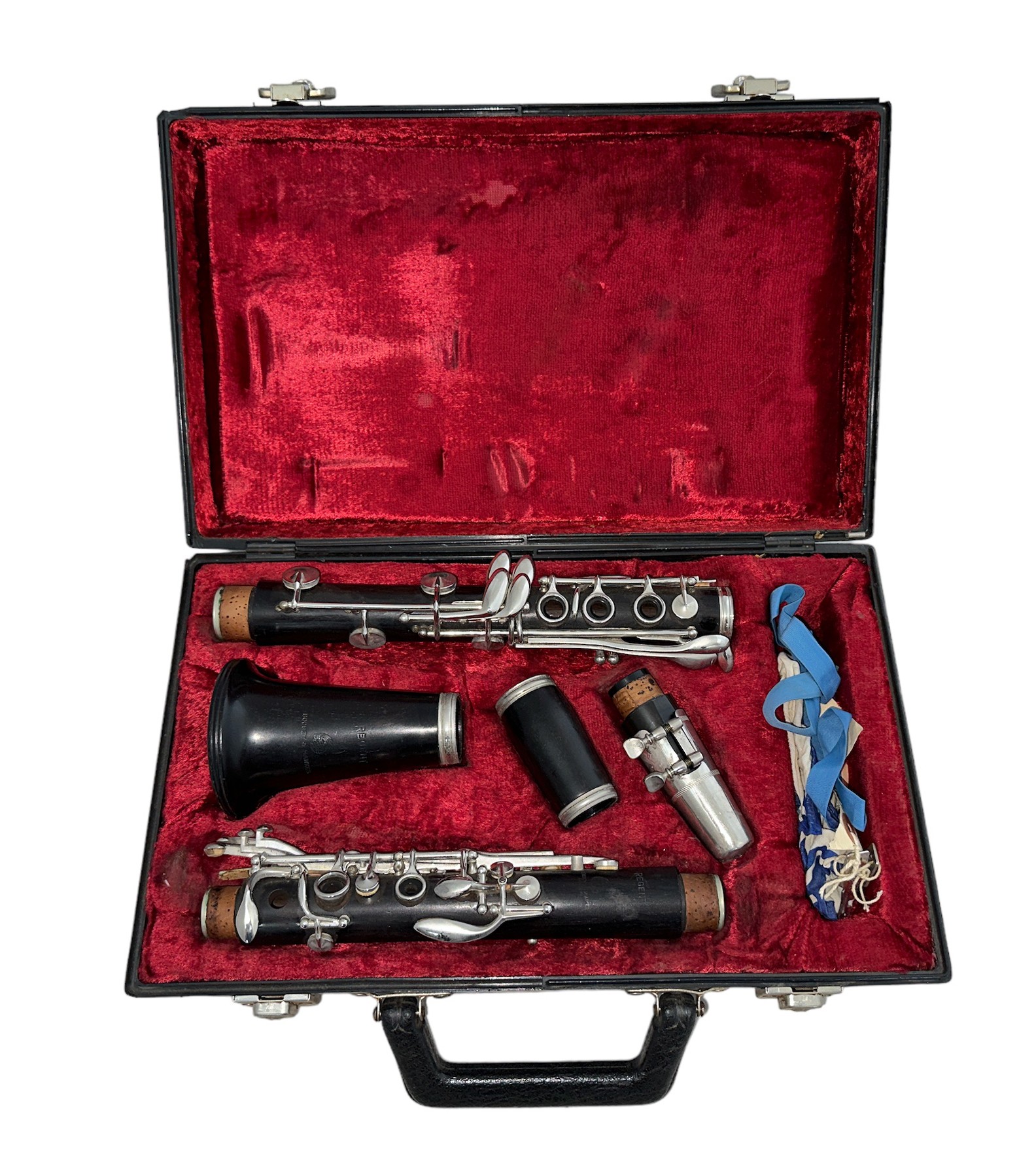 A Boosey & Hawkes 'Regent' ebonised section clarinet in plush lined hard case.