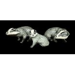 Beswick, a group of three Badger figurines, to include; two seated badgers (facing opposite