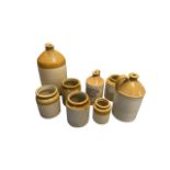Three stoneware flagons with five stoneware pots, to include 2 gallon "3833 John G Baker Wine &